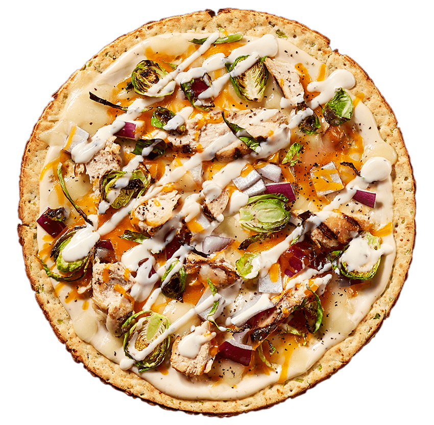 Gluten Free Broccoli Cheddar Crust with Chicken Ranch – A creamy Alfredo sauce tops our signature par-baked pizza crust and is topped with a cheddar Jack cheese blend, grilled chicken breast, pan roasted brussel sprouts and cooked cooked to perfection then drizzled with tangy ranch dressing and a healthy dose of fresh ground black pepper